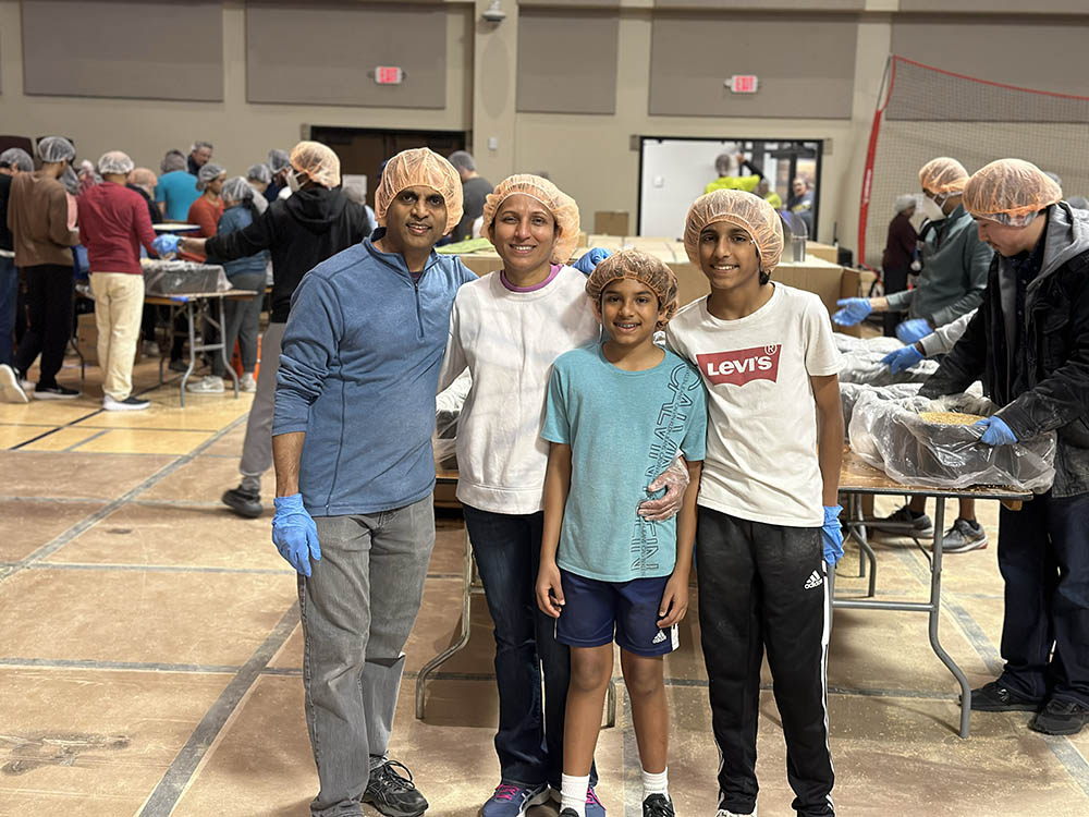Dr. Thirtha and Family Helping Others